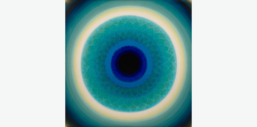 Set against a black background, a bright yellow ring stands out against subtle blue and green concentric rings with a faint geometric floral pattern in the centre.