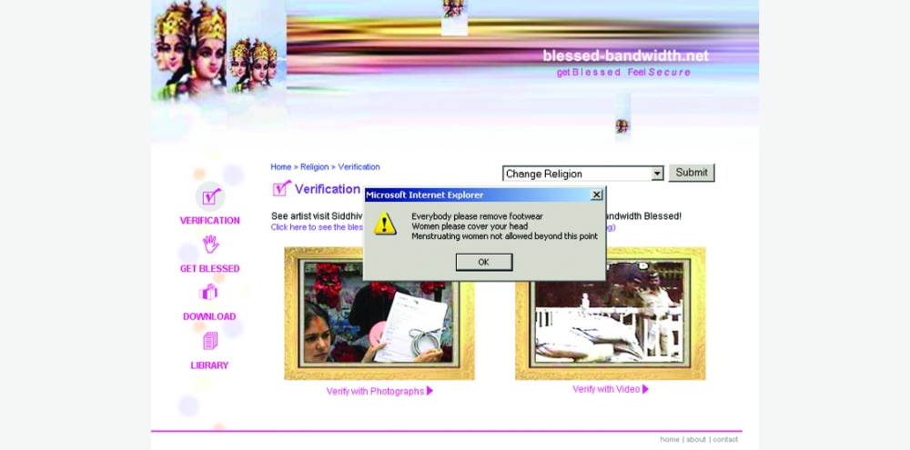 A verification web page with an English warning message in a pop-up box stating, ‘Everybody please remove footwear. Women please cover your head. Menstruating women not allowed beyond this point’.